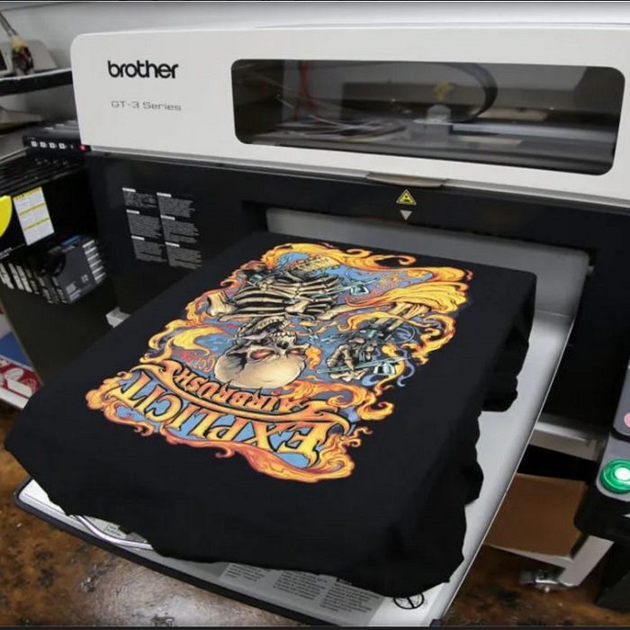 DTG Printer with black shirt and printed graphic